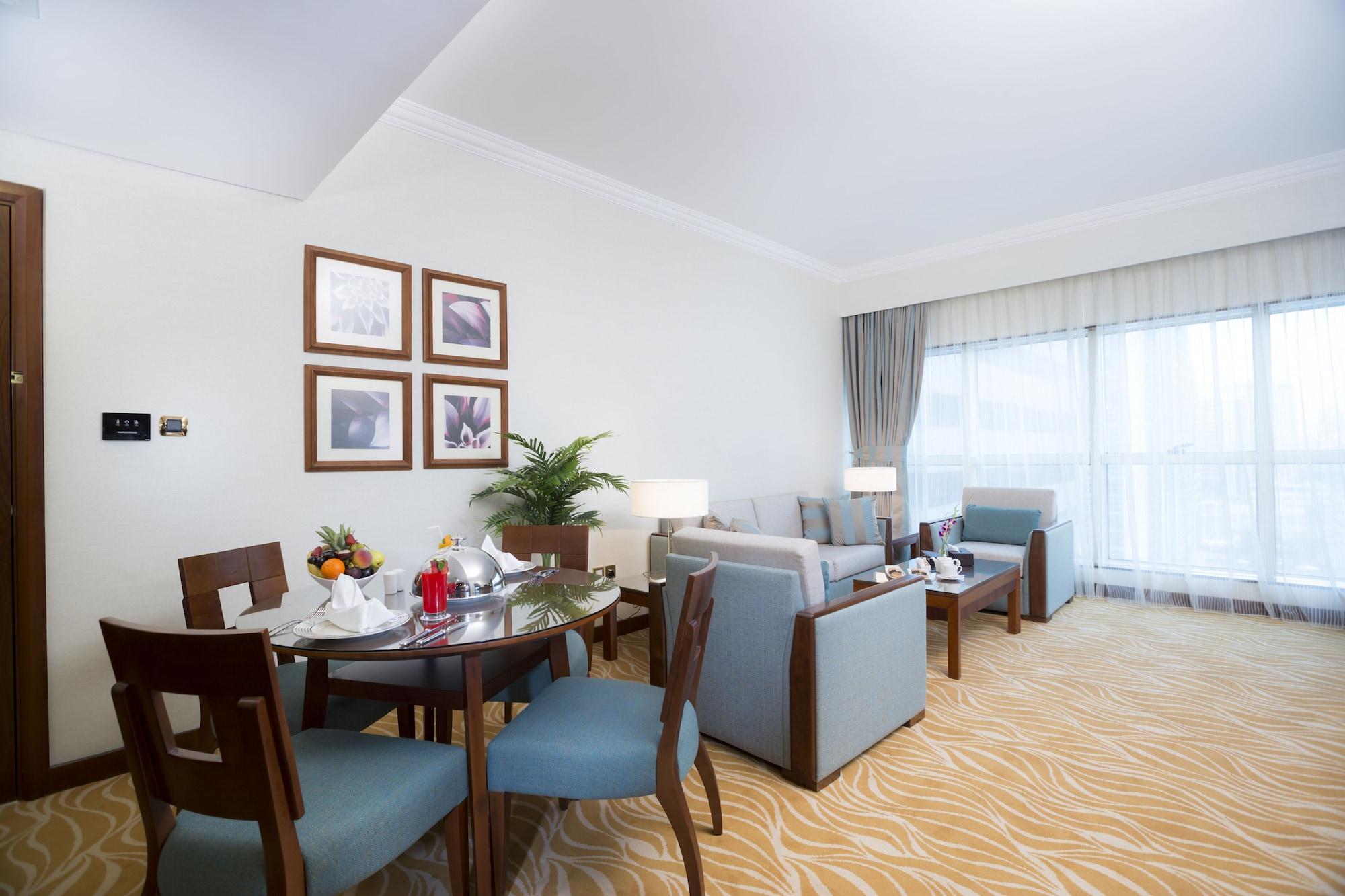 Grand Mercure Majlis Residences Abu Dhabi Bagian luar foto A living room at the hotel